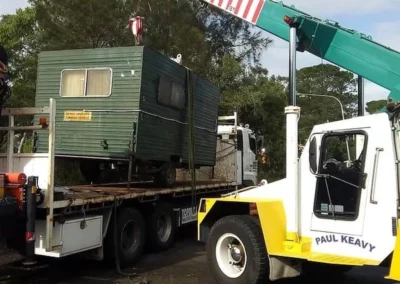 work site shed relocation crane pick and carry truck