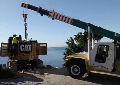 lift excavation machinery CAT with mobile franna crane sydney