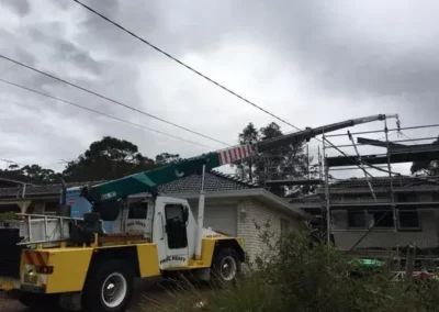 mobile franna crane building site lift building materials onto roof